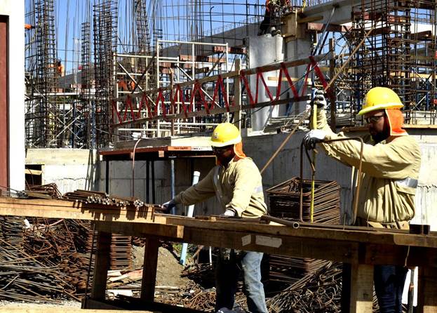 A group of men working at a construction site

AI-generated content may be incorrect.